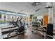 On-site gym features treadmills, weights, and large windows overlooking the pool at 1271 Ponti Nw Mews # 92, Atlanta, GA 30318