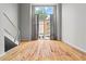 Inviting living area with gleaming hardwood floors and a large window offering natural light at 1271 Ponti Nw Mews # 92, Atlanta, GA 30318