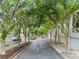 Street view of homes with tree-lined street at 1271 Ponti Nw Mews # 92, Atlanta, GA 30318