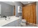 Bathroom featuring a vanity, mirror, cabinet and bathtub with patterned curtain at 1605 Little Lisa Ln, Snellville, GA 30078