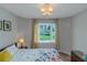 Bright bedroom with natural light from the window and charming chandelier at 1605 Little Lisa Ln, Snellville, GA 30078