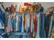 Walk-in closet with clothes on hangers and a shelf of bags, offering ample storage at 1605 Little Lisa Ln, Snellville, GA 30078