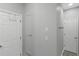 Hallway with multiple closets and neutral paint at 1605 Little Lisa Ln, Snellville, GA 30078