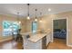 Kitchen with granite countertops, stainless steel appliances, and hardwood floors at 1605 Little Lisa Ln, Snellville, GA 30078