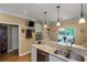 Kitchen with granite countertops, stainless steel appliances, and hardwood floors at 1605 Little Lisa Ln, Snellville, GA 30078