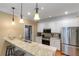 Bright kitchen with stainless steel appliances and granite countertops perfect for cooking and entertaining at 1605 Little Lisa Ln, Snellville, GA 30078