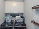 Modern laundry room with front loading washer and dryer and shelving at 1605 Little Lisa Ln, Snellville, GA 30078