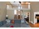 The living room showcases an open floor plan and staircase with a view of the dining room at 1605 Little Lisa Ln, Snellville, GA 30078