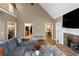 Bright open-concept living room with vaulted ceilings and stone fireplace at 1605 Little Lisa Ln, Snellville, GA 30078