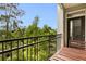 Outdoor balcony space with wood table set, lush greenery, and skyline views from the comfort of your home at 390 17Th Nw St # 4055, Atlanta, GA 30363