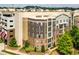 Apartment building complex with green trees, well-maintained landscaping, and steps leading to the entrance at 390 17Th Nw St # 4055, Atlanta, GA 30363