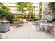 Relaxing courtyard with outdoor tables and grill area for community enjoyment and outdoor dining experiences at 390 17Th Nw St # 4055, Atlanta, GA 30363