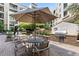 Charming courtyard area with outdoor seating, a grill, and mature landscaping, perfect for social gatherings and relaxation at 390 17Th Nw St # 4055, Atlanta, GA 30363