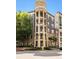 Attractive multi-story condo building with a brick and tan facade and several balconies at 390 17Th Nw St # 4055, Atlanta, GA 30363