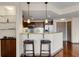 Kitchen breakfast bar featuring granite counters, pendant lights, and stainless steel appliances at 390 17Th Nw St # 4055, Atlanta, GA 30363