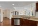 Open concept kitchen with stainless steel dishwasher and views of the living room at 390 17Th Nw St # 4055, Atlanta, GA 30363