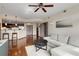 Spacious living room with hardwood floors, kitchen view, and modern furnishings at 390 17Th Nw St # 4055, Atlanta, GA 30363