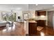 Bright living room with hardwood floors and open floor plan with views of the balcony at 390 17Th Nw St # 4055, Atlanta, GA 30363