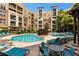 Inviting pool area with comfortable lounge chairs, tables, and lush landscaping for a relaxing outdoor experience at 390 17Th Nw St # 4055, Atlanta, GA 30363