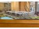 Scale model of building in display case, highlighting the architectural design and landscape of the property at 390 17Th Nw St # 4055, Atlanta, GA 30363
