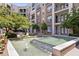 Attractive water feature with cascading steps and lush greenery, creating a serene and tranquil outdoor space at 390 17Th Nw St # 4055, Atlanta, GA 30363