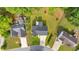 Aerial view of a home with a dark gray roof, surrounded by lush greenery at 4807 Willowwood Ne Dr, Kennesaw, GA 30144