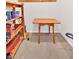 Unfinished basement storage space with wood shelving and drop leaf table at 4807 Willowwood Ne Dr, Kennesaw, GA 30144