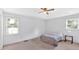 Bright bedroom featuring vaulted ceiling, two windows and hardwood floors at 4807 Willowwood Ne Dr, Kennesaw, GA 30144