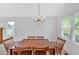 Dining room featuring a chandelier and a large window at 4807 Willowwood Ne Dr, Kennesaw, GA 30144