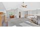 Open-concept living room with vaulted ceilings, fireplace, and combined dining area at 4807 Willowwood Ne Dr, Kennesaw, GA 30144