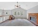 Bright living area showcasing vaulted ceilings, large windows, and a cozy brick fireplace at 4807 Willowwood Ne Dr, Kennesaw, GA 30144