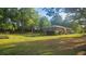 Expansive backyard showcasing a well-maintained lawn and mature trees at 112 Hilltop Dr, Newborn, GA 30056
