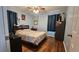 Cozy bedroom with wood floors, ceiling fan and charming decor at 112 Hilltop Dr, Newborn, GA 30056