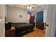 Picture showcasing a bedroom featuring wood floors and blue walls at 112 Hilltop Dr, Newborn, GA 30056