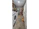 Efficient laundry room with washer, dryer and storage shelves at 112 Hilltop Dr, Newborn, GA 30056