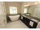 Beautiful bathroom features a sleek freestanding tub, double vanity, and modern fixtures at 116 Festoon Ct, Smyrna, GA 30080