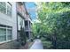 Charming brick townhome featuring lush landscaping and a quaint covered front porch at 116 Festoon Ct, Smyrna, GA 30080