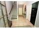 Foyer featuring tiled floor, staircase, and light gray walls at 116 Festoon Ct, Smyrna, GA 30080