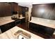 Bright kitchen featuring dark cabinetry, stainless steel appliances, and island at 116 Festoon Ct, Smyrna, GA 30080
