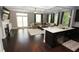 Spacious living room featuring a fireplace, hardwood floors, and a central island at 116 Festoon Ct, Smyrna, GA 30080