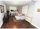Cozy living room area with hardwood floors, plush seating, and ample natural light at 116 Festoon Ct, Smyrna, GA 30080