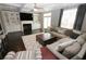 Comfortable living room with hardwood floors, a fireplace, and built-in bookcases at 116 Festoon Ct, Smyrna, GA 30080