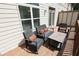 Private outdoor patio featuring stylish furniture and wood plank flooring at 116 Festoon Ct, Smyrna, GA 30080
