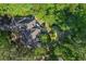 Home with circular driveway surrounded by mature trees, offering privacy and curb appeal at 181 Sentinel Pl, Marietta, GA 30067