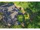 Overhead of home with back deck, circular driveway, and mature trees on a large lot at 181 Sentinel Pl, Marietta, GA 30067
