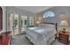 Comfortable bedroom featuring a large bed, natural light, and an attached sunroom at 181 Sentinel Pl, Marietta, GA 30067