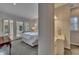 Bright bedroom with access to sunroom, and an adjacent well-lit bathroom at 181 Sentinel Pl, Marietta, GA 30067