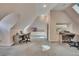 Large bonus room offers flexible space with sloped ceilings, desk and recording console at 181 Sentinel Pl, Marietta, GA 30067