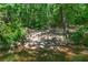 Wooded home lot featuring a natural creek area in a beautiful, lush setting at 181 Sentinel Pl, Marietta, GA 30067