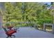 Outdoor deck with seating offers a relaxing space to enjoy the surrounding natural beauty and scenery at 181 Sentinel Pl, Marietta, GA 30067